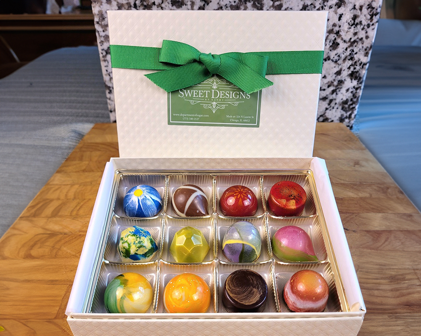 Image of an assortment of candies and chocolates in a box made by Sweet Designs by Kathy